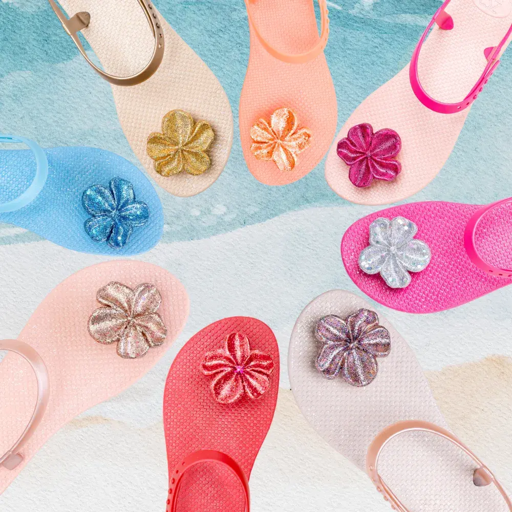 Colorful ZHOELALA sandals decorated with bright floral details.